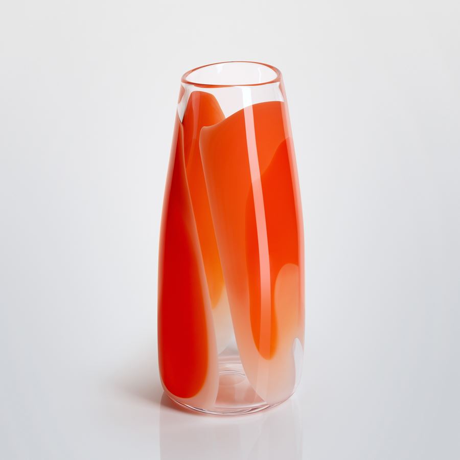 tall soft cylinder vase made from hand blown clear glass with wide soft bands of colour in pink peach orange and red