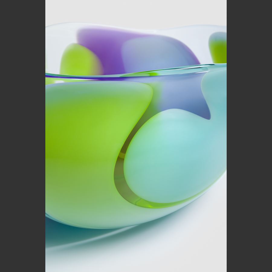 abstract amorphic hand made clear glass centrepiece with chunky soft curved bands of colour in opaque lime purple and dove blue