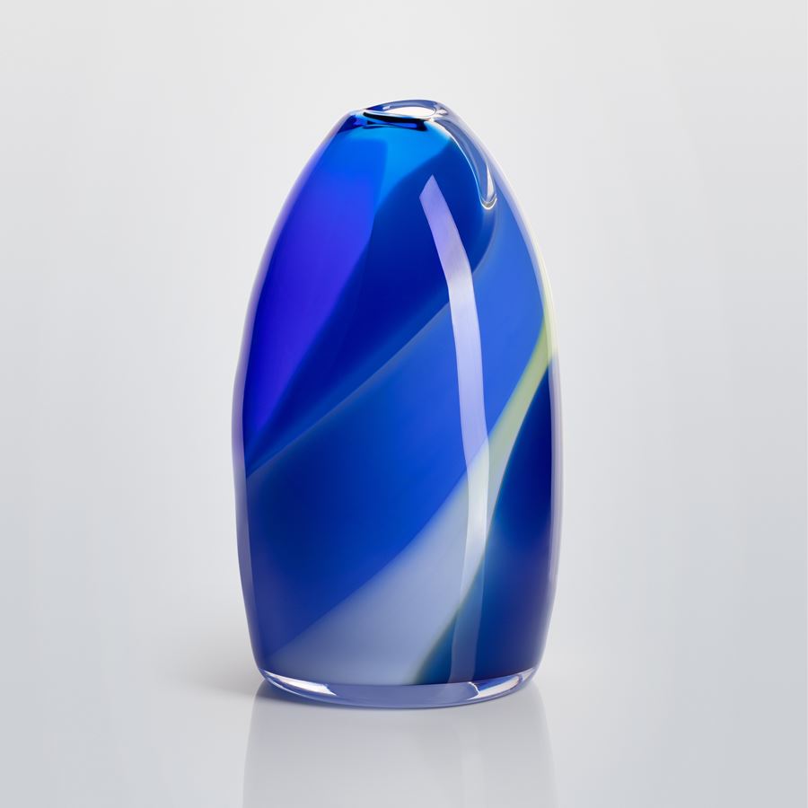 soft bullet shaped handblown clear glass vase with small top opening and abstract soft wide curled bands of colour in blue lilac and green