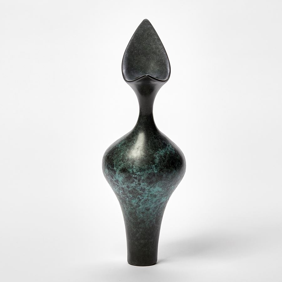 tall dark grey green and jade organically patterned abstract bird shaped sculpture with narrow base, widening middle and sleek top beak form inspired by brancusi hand made from bronze