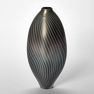 black and pewter amorphic shaped vessel with small top opening and fine white line lace like pattern covering the surface hand made from glass