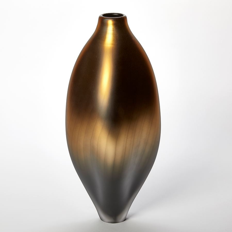 tall soft oval standing vessel with small opening at the top in metallic gold bronze and grey handmade from glass