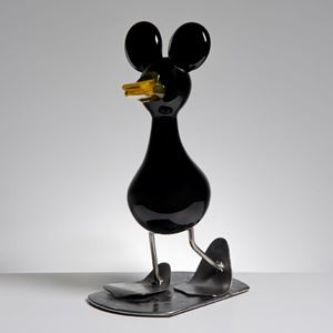 decorative blown glass ornament of a cartoon duck with steel legs and base