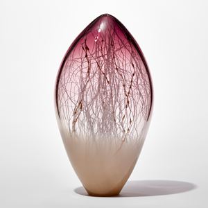 clear and opaque tall rounded glass sculpture with soft pointed top with beige base and aubergine purple top with fine white canes traversing and trapped inside mixed with gold ones with bulbous sections like seaweed