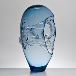 light blue seethrough oblong-shaped glass-art sculpture vessel with handle and abstract pattern