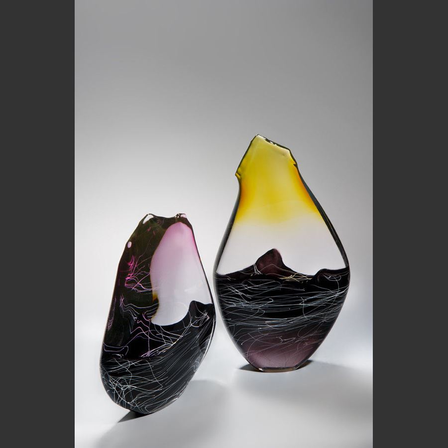 blown and sculpted glass ornament in abstract teardrop shape in black clear and pink 