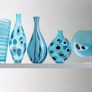five glass vase sculptures of different sizes in aqua blue 