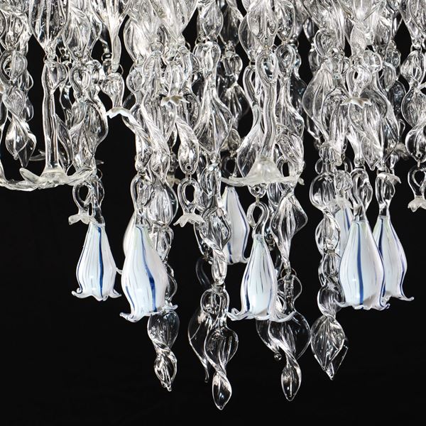 glass chandelier made from flower shaped pieces on steel frame