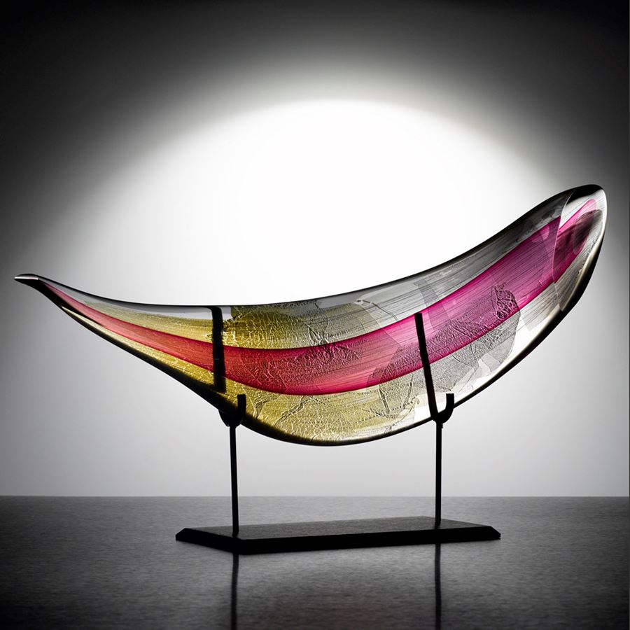 hand blown art glass leaf shape with bright colours on black steel base