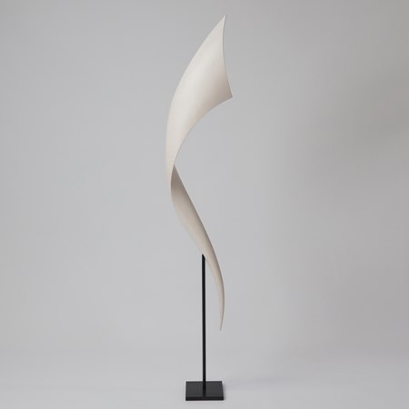 tapering curved white long vertical curling wooden sculpture held aloft on a simple black steel stand