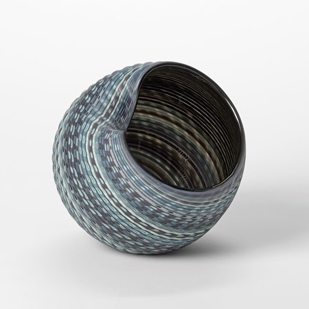 round textured vessel with bands of colours in jade indigo blue cream and white with matt exterior and glossy interior hand made from glass