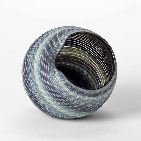 round vessel with offset wide opening with looping rim in colours of jade indigo blue cream and white handmade from glass