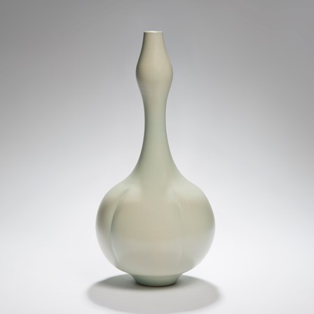porcelain vase sculpture in green with wide botton and thin top