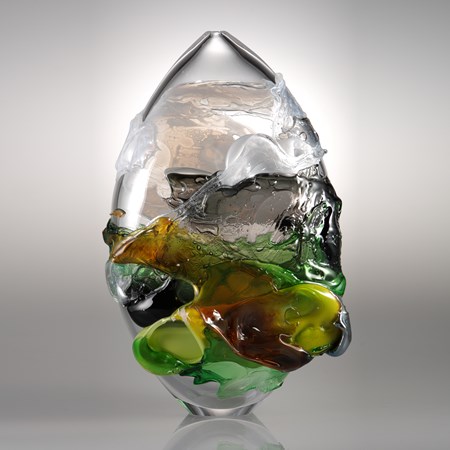 sculpted clear glass decorative art piece with dark green yellow and orange splashes