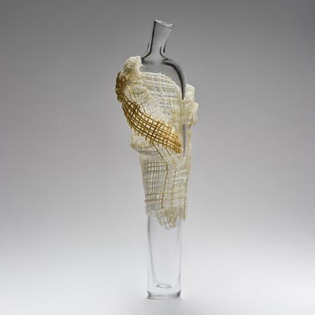 tall abstract blown glass sculpture of vase resembling cloaked figure