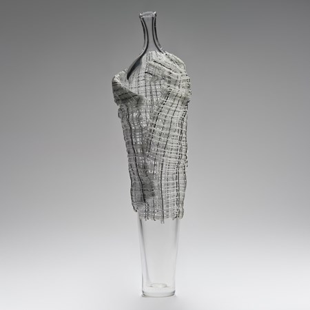 tall contemporary art-glass sculpture of vase with cane cloak resembling human form