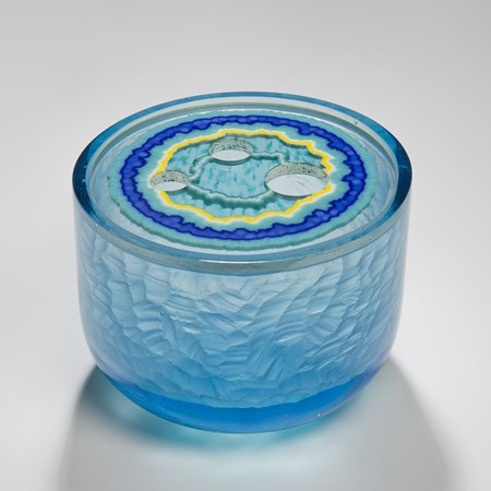 cast glass sculpture of jar in blue yellow and clear colours with white gold gilt
