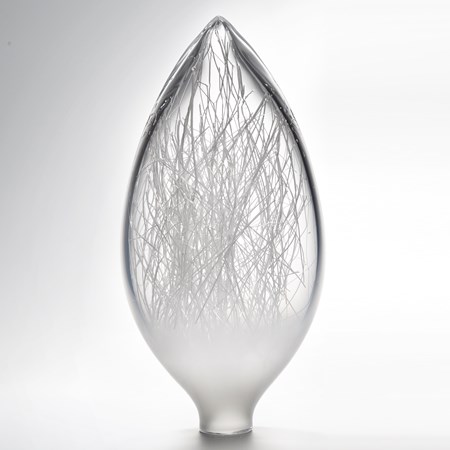 tall oval shaped clear white art glass vase revealing inner wintery wire sculpture