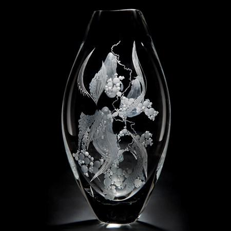 two clear glass vases with engraved flower patterns