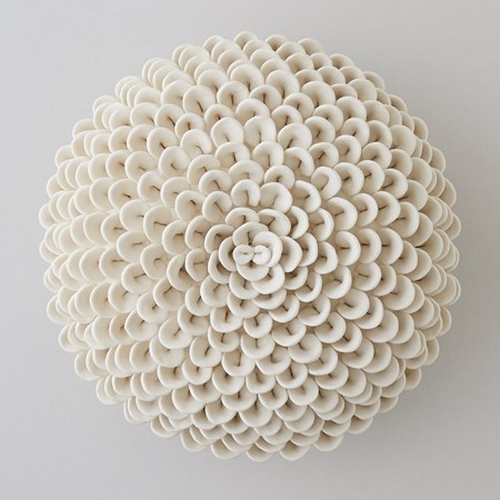 white porcelain sculpture of dahlia flowers arranged in sphere