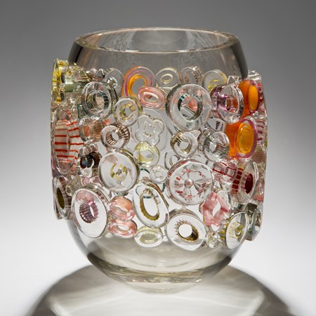 clear and grey wide handblown glass vase with circular additions in clear orange and yellow