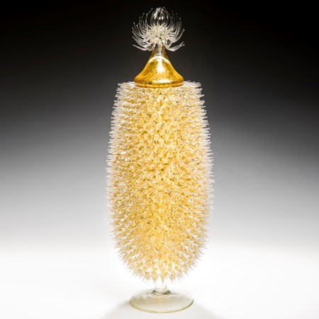tall art-glass jar in yellow and gold with thistle shaped centre