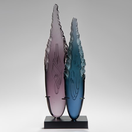 two plum and blue glass shard sculptures on black rectangular base