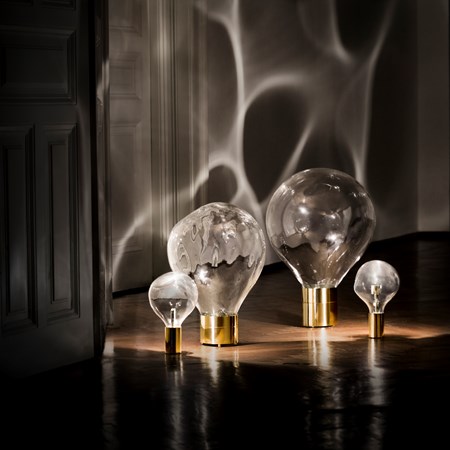 glass art moving lightbulb collection with brass base