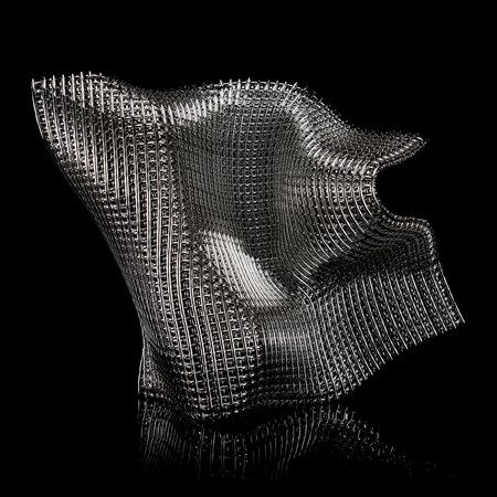 asymmetric organic standing sculpture with the appearance of chunky woven metallic cloth