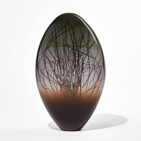 dark brown grey and black ovoid handmade glass sculpture with inner line detail in black and gold