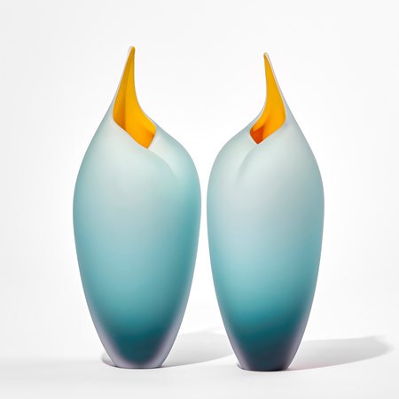 teal tall bird handmade glass sculptures with open beaks and yellow mouths