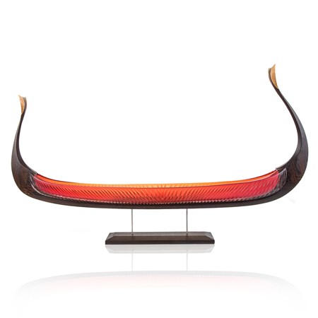 handblown glass and carved wood sculpture of viking ship in red and dark brown