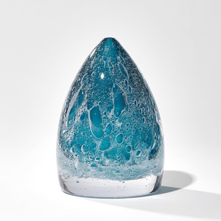 deep blue soft cone shaped sculpture with effervescent trapped bubbles handmade from glass