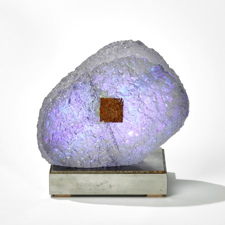 lilac purple and grey rock sculpture on a square steel base hand made from glass