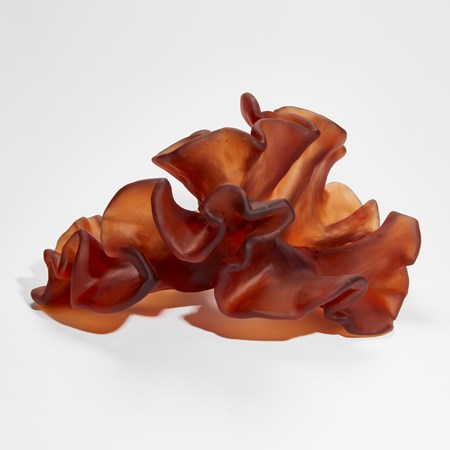 burnt orange amber organic seaweed like sculpture hand made from cast glass