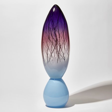 glass sculpture in two parts joined together rounded base in turquoise with pointed top in aqua and purple with interior cane detail hand made from glass