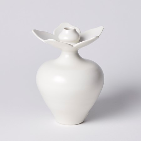 round white vase with tapered base and five petalled flower shaped rim with additional bud form in the middle hand made from porcelain