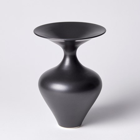 rounded black vase with wide flared rim and narrow neck hand made from porcelain