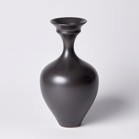 black classical vase with sweeping cursed narrow neck and flaring double rimmed lip hand made from porcelain