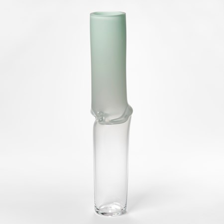 tall cylinder traversing and fading from clear at the base to opaque soft mint green at the top with a creased and rippled centre hand made from glass
