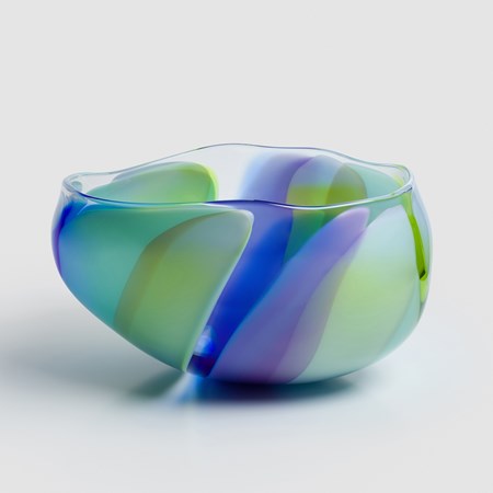 low amorphous hand made clear glass bowl with soft wide finger bands of colour in royal blue green jade aqua and olive green  