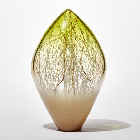 clear and opaque standing glass sculpture with pointed top in light bronze and lime green with fine white canes trapped inside mixed with gold ones with bulbous rounded sections