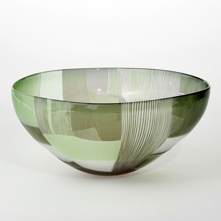 round translucent grey and green bowl covered in abstract landscape cut patterns handblown from glass