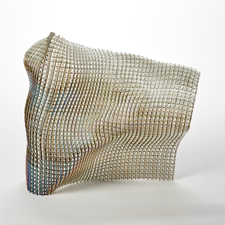 standing abstract glass sculpture with the appearance as if made from woven fabric with the front surface with a shimmering iridescent finish