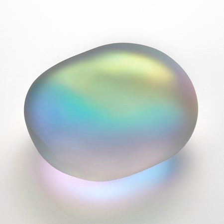 amorphic smooth opaque clear glass stone with satin surface and interior filled with a myriad of colours which appear to emanate from its interior