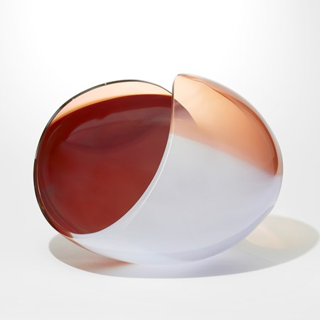 ovoid with cut away elliptical area leaving a figure of eight looping rim hand blown from opaque soft grey peach and ox blood red glass