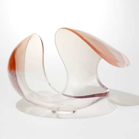 ovoid with cut away elliptical section hand blown and cut from opaque white merging to soft peach glass