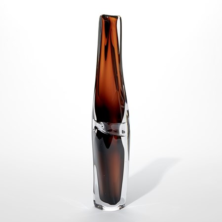 tall transparent dark brown and clear vase with slight twist in the shape and soft fluid silhouette hand made from glass
