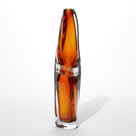 tall handmade glass vase with fluid lines and soft shape with outer layer of clear and inner of rich transparent amber orange