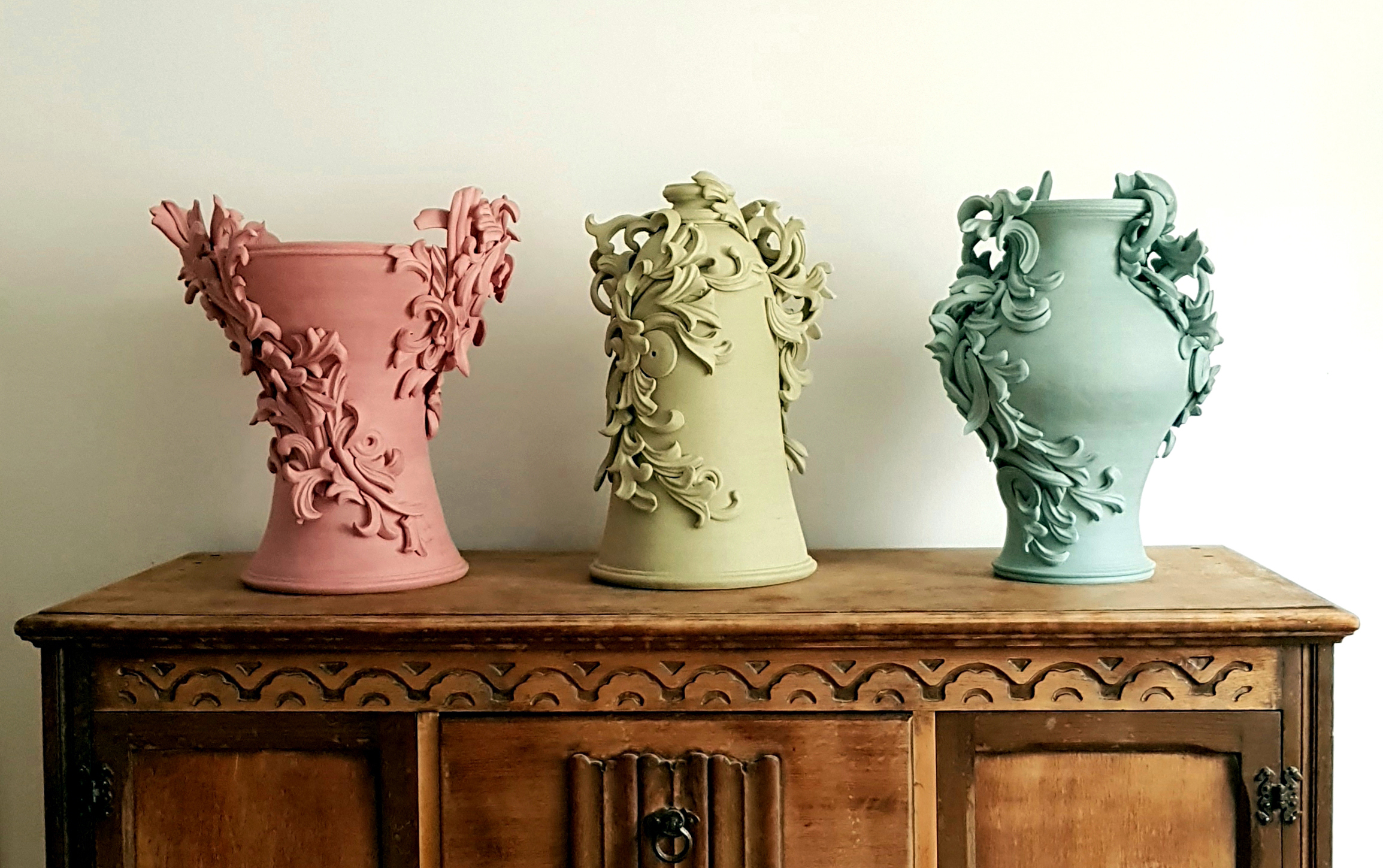 clay vase coloured stoneware sculptures in pink, yellow and turquoise